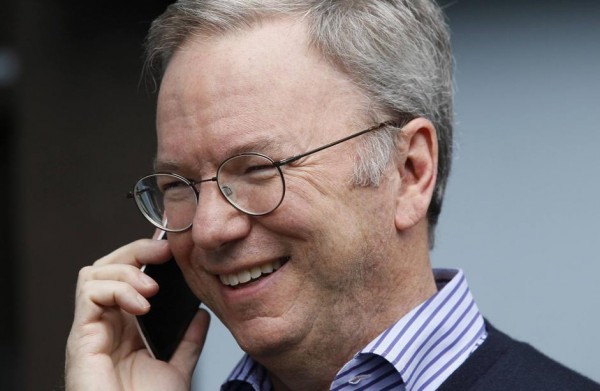 Eric Schmidt, executive chairman of Google, talks on the new yet to be released Google produced Moto X phone at the annual Allen and Co. conference in Sun Valley