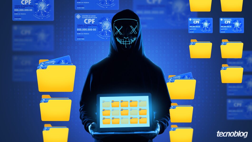 Hacker segura notebook com dados pessoais vazados, incluindo CPFs, organizados em pastas