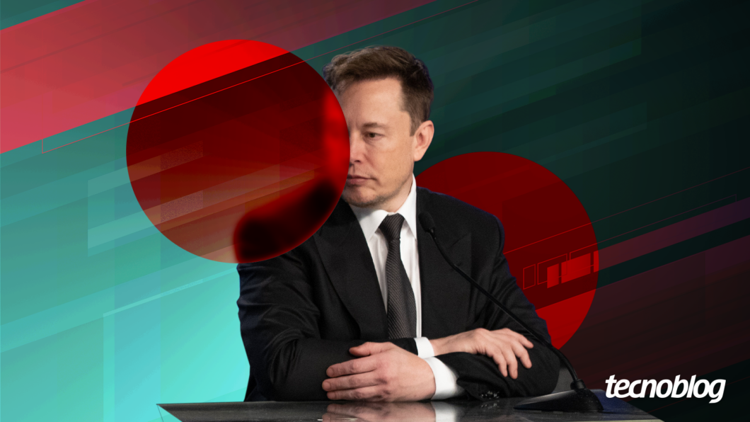 Elon Musk sentado com braços cruzados olhando para o lado esquerdo