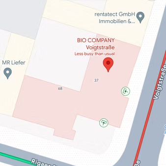 Tela do Google Maps com prédio selecionado e ícones verdes indicando entradas