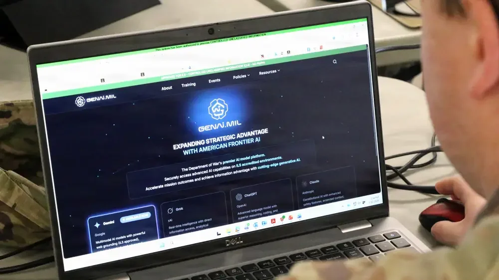 Tela do sistema GenAI.mil no computador, com texto “GenAI.mil” e interface do Pentágono
