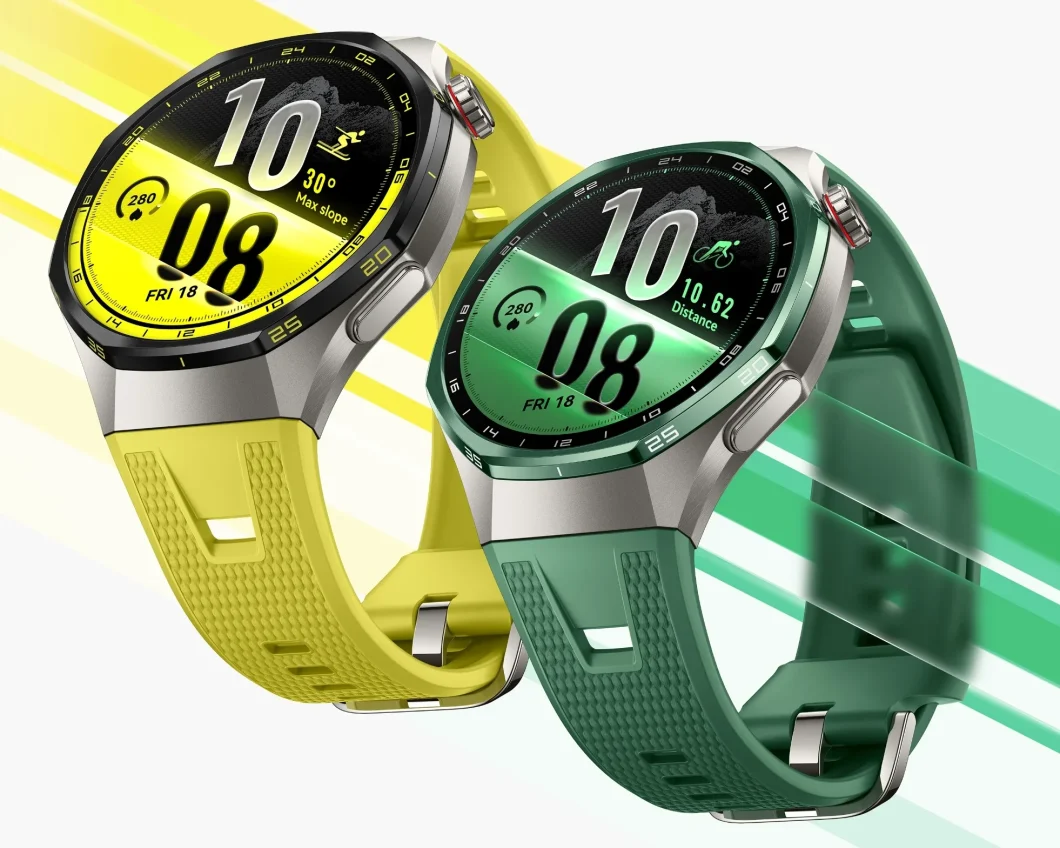 Dois relógios inteligentes esportivos posicionados em diagonal sobre fundo verde. O da esquerda é amarelo-esverdeado com mostrador amarelo e pulseira de silicone perfurada. O da direita tem mostrador e pulseira na cor verde-escuro.